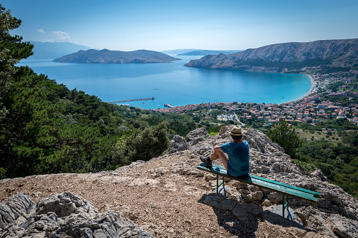 Senior man hiking on Krk Island in Croatia in summer,  Europe. Nikon D850.