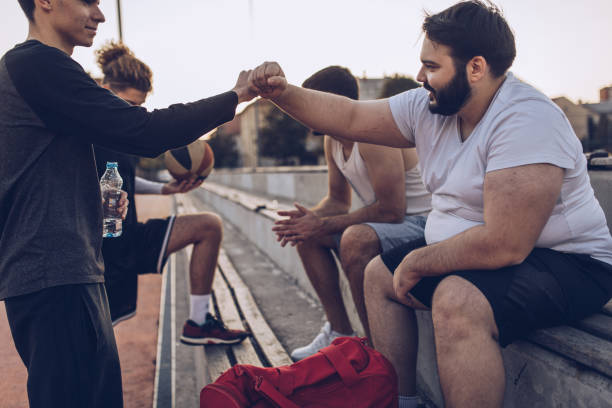 istock Streetball friends resting 1058535574