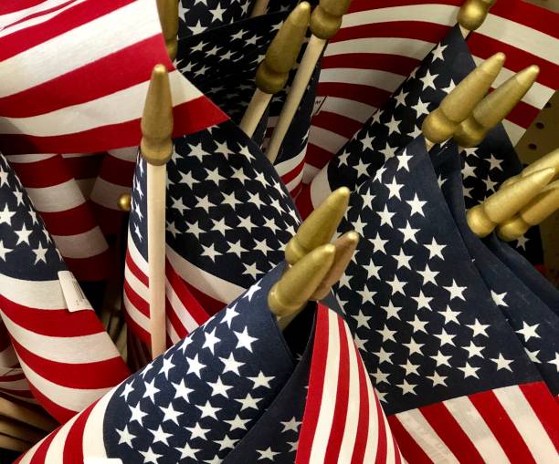 istock Group of American Flags on display 1058535758