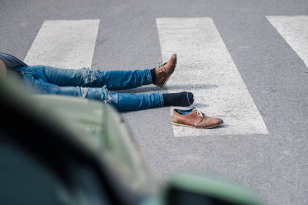 istock Traffic accident. Young man hit by a car 1058540434