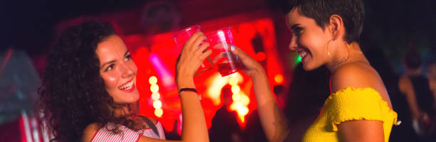 istock Young women drinking and clubbing 1058542822