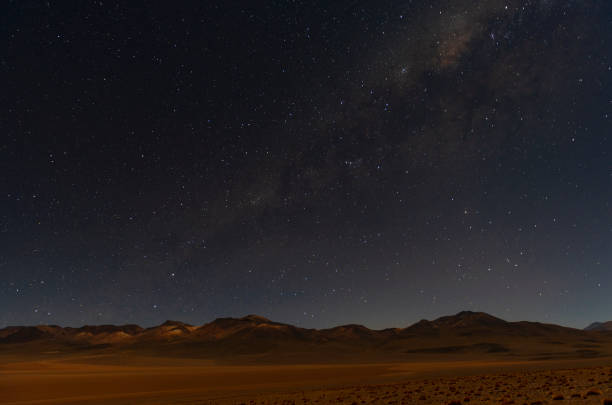 Milky Way in the Andes Mountain Range, Bolivia The Milky Way shining in the Siloli Desert in the Andes Mountain Range of Bolivia near the Uyuni Salt Flat and the Atacama desert in Chile, South America. bolivian andes photos stock pictures, royalty-free photos & images