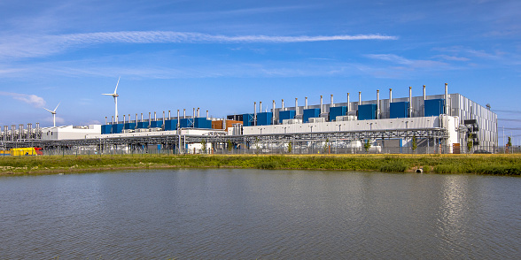 5 JULY 2016, EEMSHAVEN, NETHERLANDS. Google Datacenter near Delfzijl in the province of Groningen under blue sky.