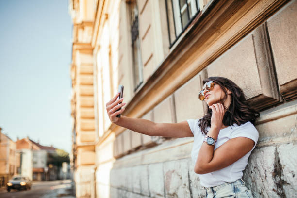 istock Young woman taking selfie 1058553858