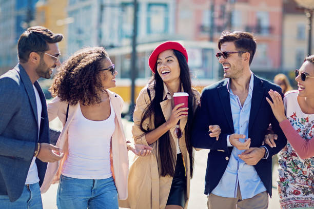 istock Happy friends are hugging and walking together 1058553940