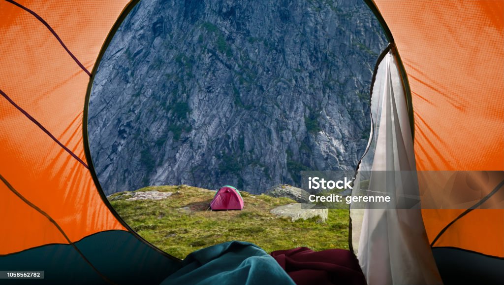 Camping on mountains Looking out from a tent to a Mountain View Norway Stock Photo