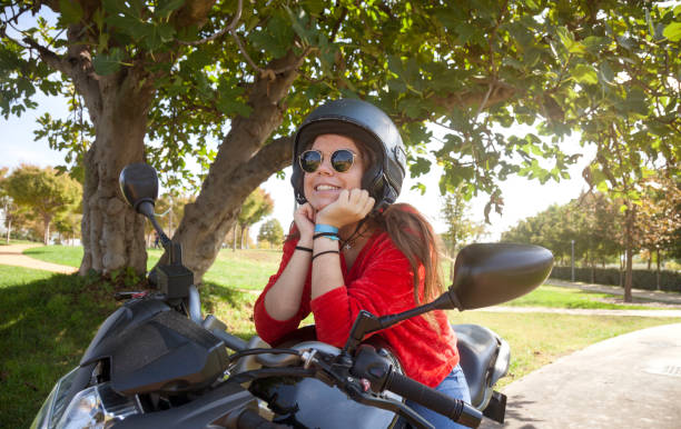 istock Young motorbiker girl 1058562804
