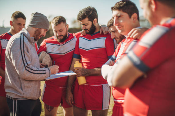 istock Rugby coach talking to players 1058564496