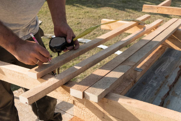 istock Roof construction building. Man measuring elements with tape measure or scoop. 1058568524