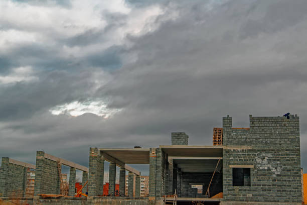 building under construction in evening sky