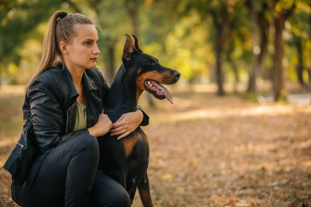 istock Girl hugging her dog 1058570804