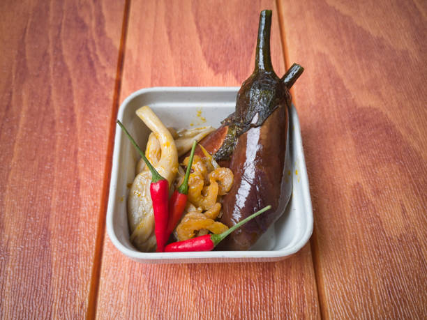 istock Vegetable eggplant mixed with mushroom and dried prawns. 1058580924