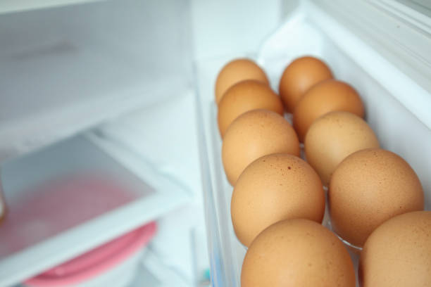 istock eggs arrange on refrigerator shelf 1058581558