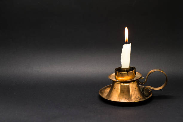 istock Vintage candle holder isolated in black background 1058593436