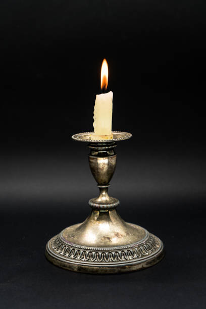 istock Vintage Candle holder with lighted candle 1058593450