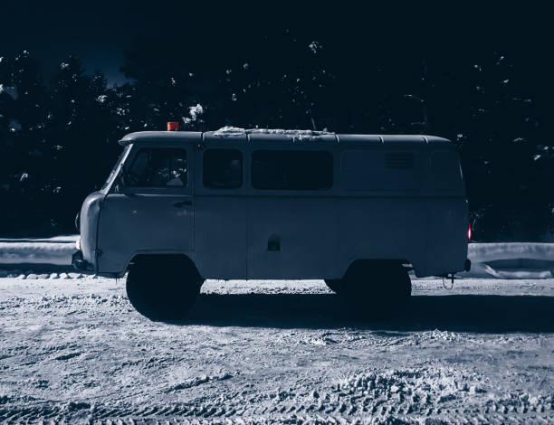 istock Old vintage car van on the snow at night 1058595126