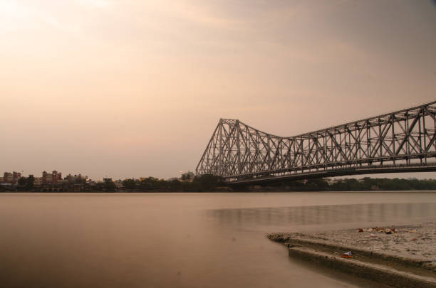 istock Howrah bridge and ganga river 1058600276