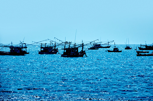 Traditional fishing boats on Gulf Of Thailand sea in island of Pattaya, Thailand