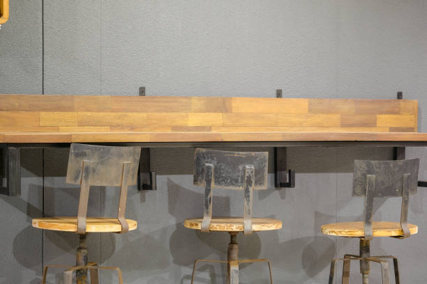 istock The chairs sit on the wall and have shelves. 1058606478