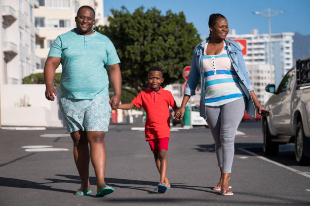 istock Young family heading to the beach 1058620738