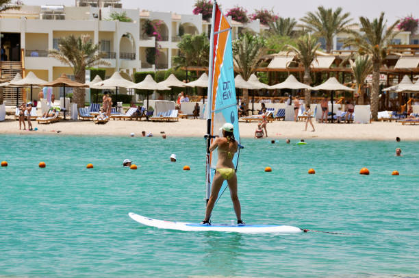 Makadi Bay, Egypt - July 9,2012:Girl Windsurfing in Makadi Bay on the Red sea