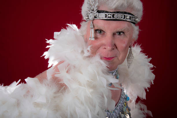 istock Older man cross dressed with boa,headband and sequins. 1058626462