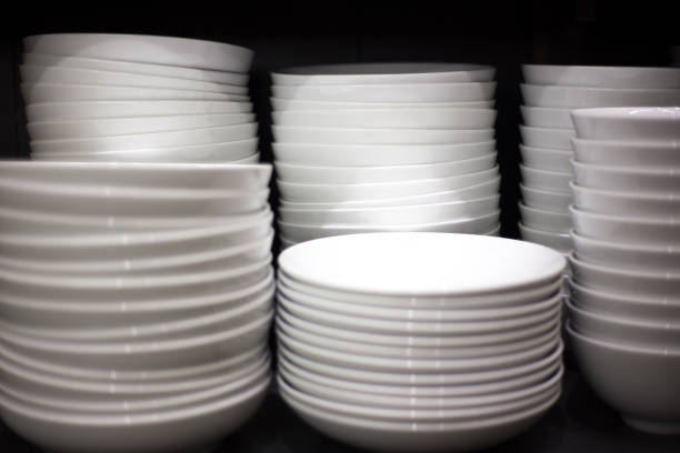 istock Stacks of White Dishes; Black Background; Copy Space 1058631460