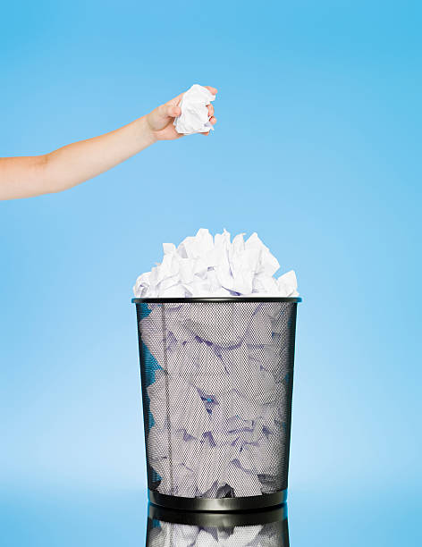 istock Trowing paper into a wastebasket 105863154