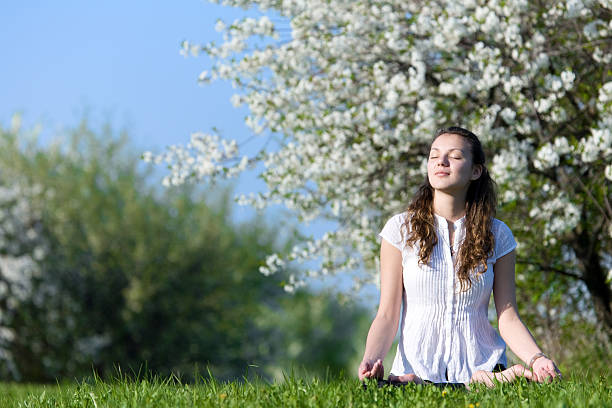 istock Young woman meditating 105863252