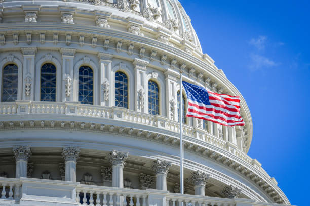 istock Capitol building in Washington DC with USA flag 1058634748