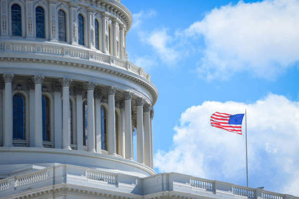 istock Capitol building in Washington DC with USA flag 1058634756