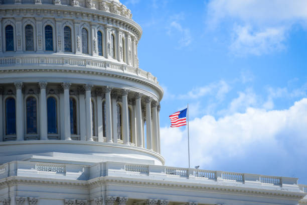 istock Capitol building in Washington DC with USA flag 1058634782