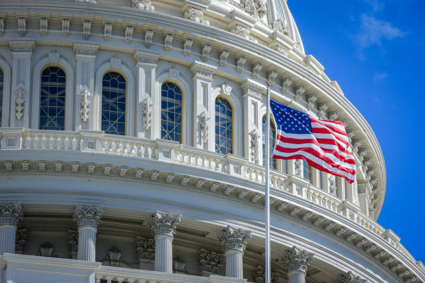 istock Capitol building in Washington DC with USA flag 1058634816