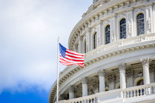 istock Capitol building in Washington DC with USA flag 1058634908