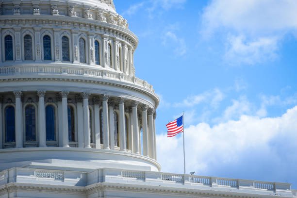 istock Capitol building in Washington DC with USA flag 1058635012