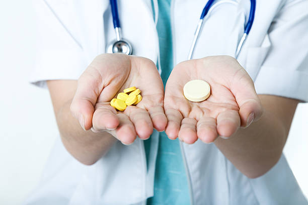 istock doctor showing two types of drops 105863508