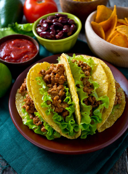 istock plate of tacos, nachos and tomato dip 1058635302