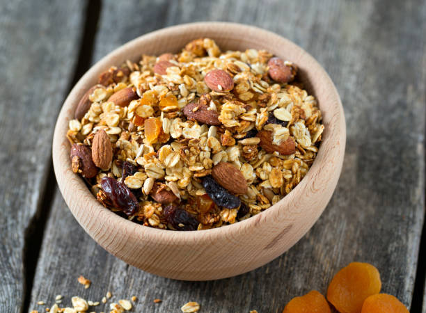 istock granola in wooden bowl 1058635472
