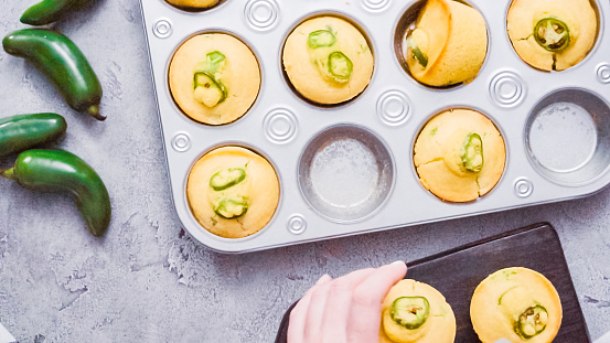 Step by step. Flat lay. Spicy jalapeno cornbread muffins in wired basket.