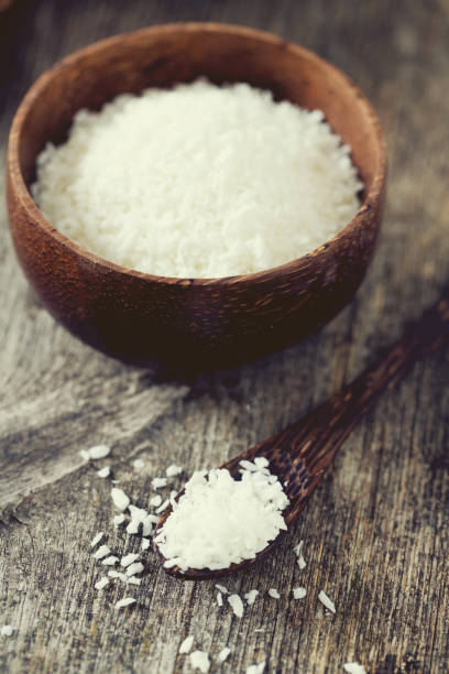 istock grated coconut on wooden surface 1058636940