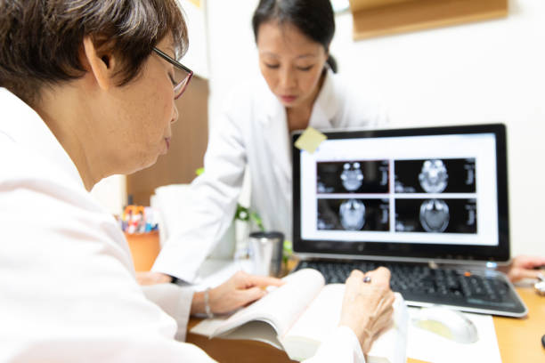 istock Senior female doctor checking MRI 1058639116