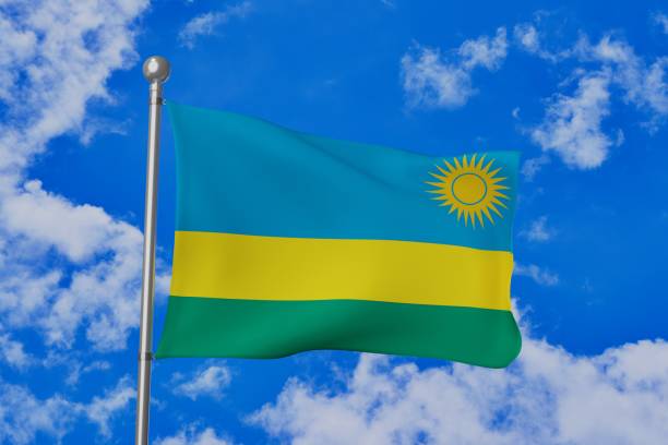 istock Rwanda national flag waving isolated in the blue cloudy sky 1058642780