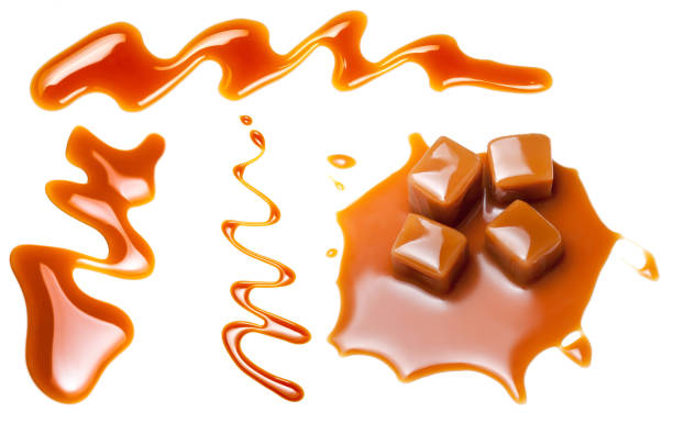 istock Sweet caramel Set. Caramel chunks with  sauce  isolated on a white background 1058643100