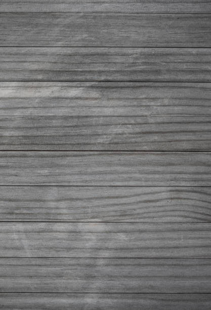istock Blank wood pattern wall with grain and scratches. Weathered wood rustic background. Grey brown color Old rough timber.
