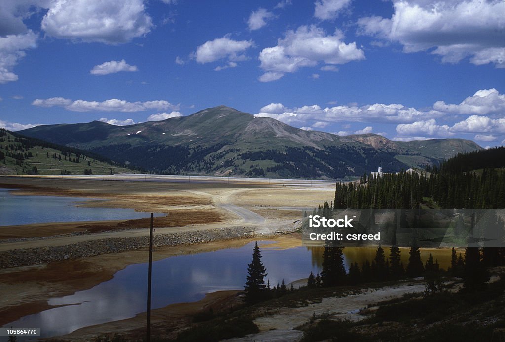 Legacy A tailings pond near Leadville, Colorado retains the unwanted rock and sludge that come from an industrial mining process. Cloud - Sky Stock Photo