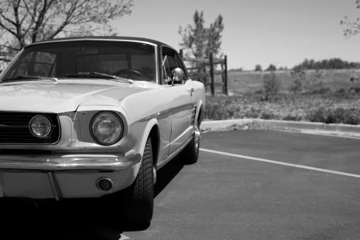 A vintage 1966 car captured in black and white.