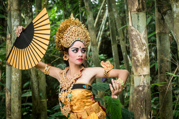 Young traditional Bali dancer in a bamboo forest