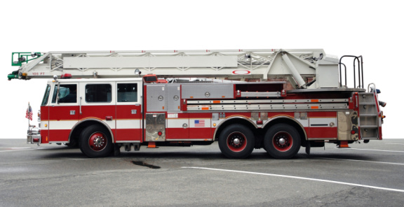 a american fire engine on street surface in partly isolated back