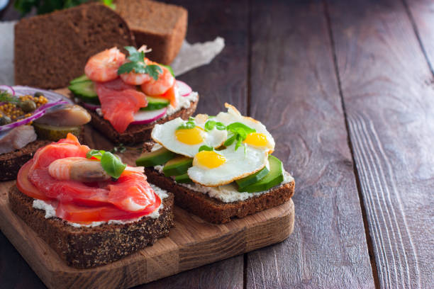istock Danish open sandwich Smorrebrod on rye bread, copying space 1058656784