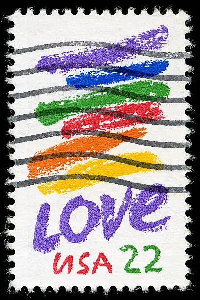 Love stamp from 1985 with rainbow paint stripes